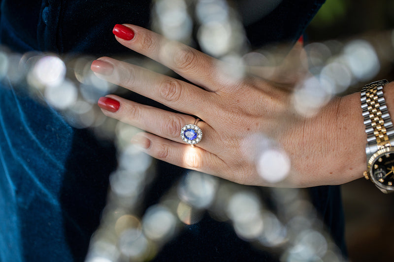 Oval shaped Tanzanite ring surrounded by approx 1ct of diamonds set in 18ct white gold